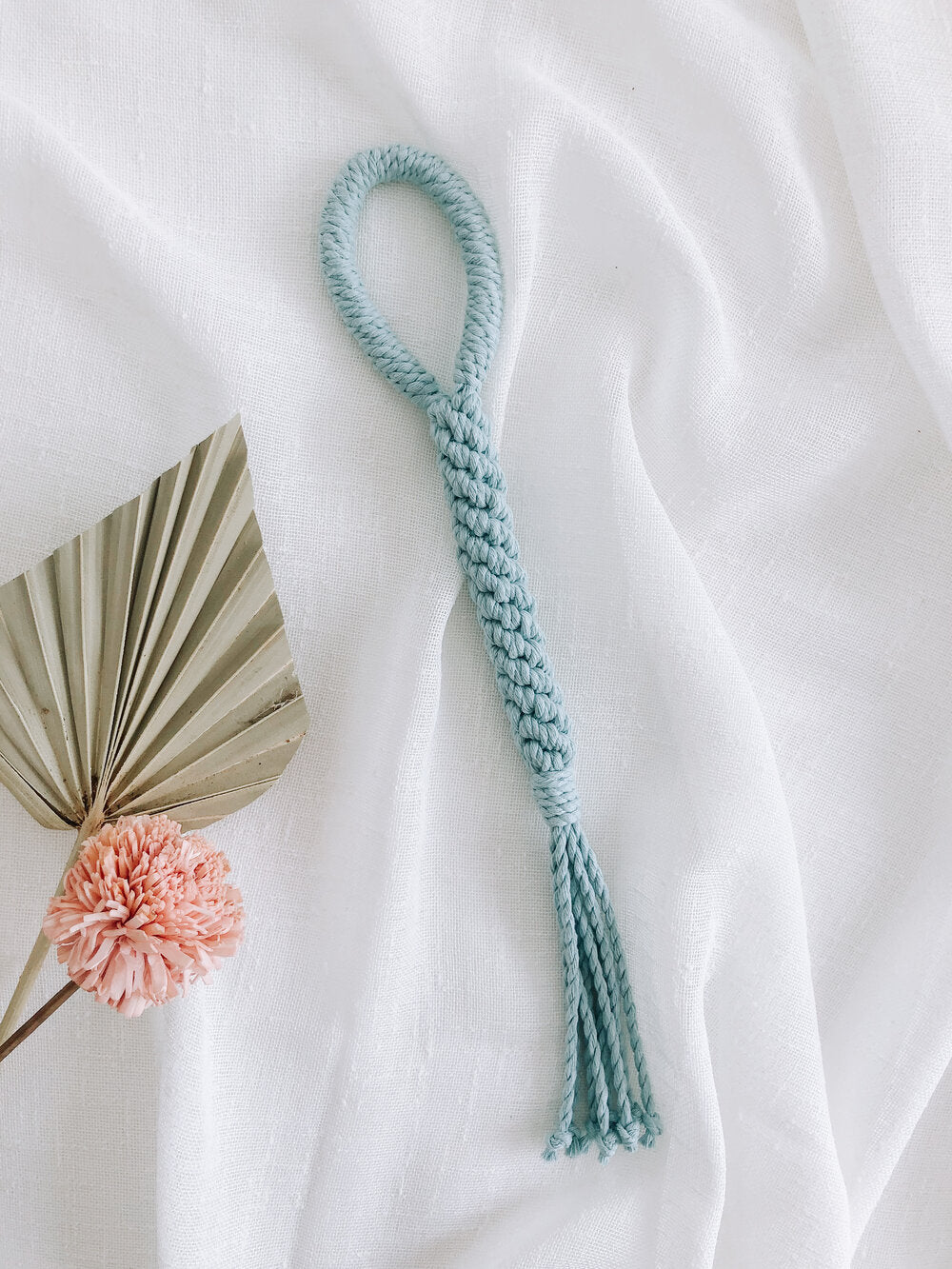 Handmade macrame dog toy in baby blue color