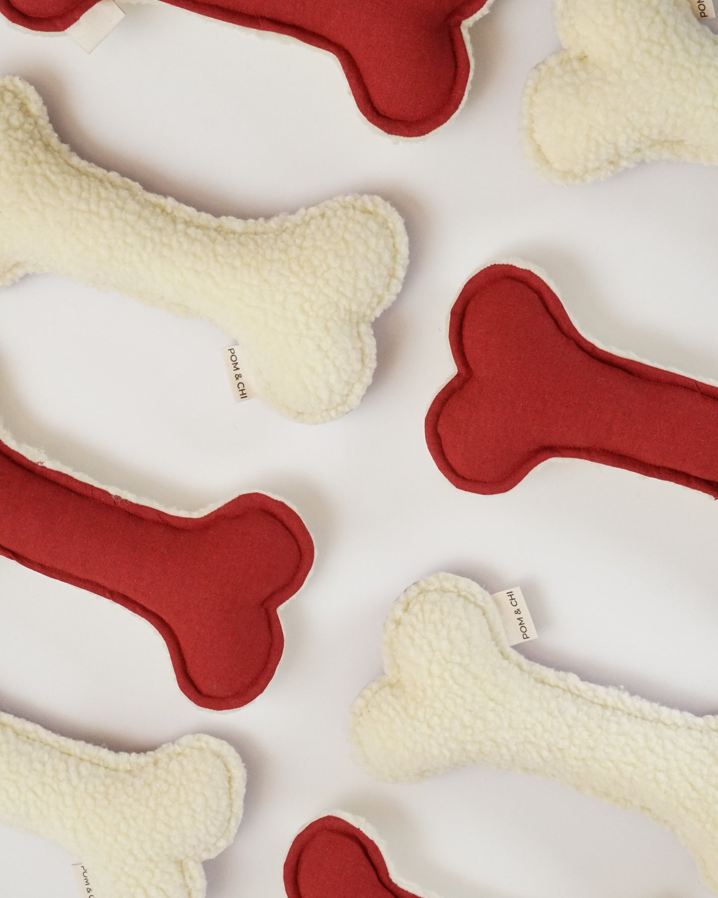 Fuzzy Bone Toy in Cranberry